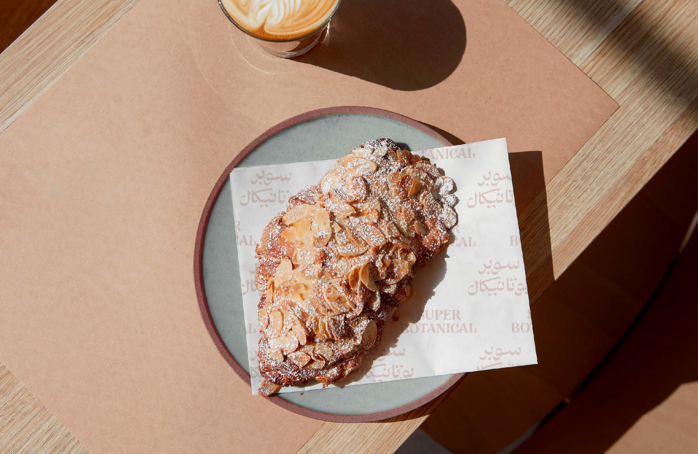 Almond Croissant on a branded paper